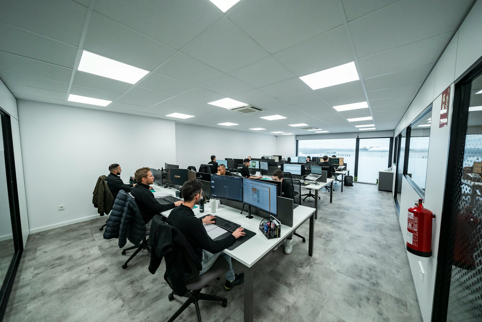 Open-plan office with people working at computers